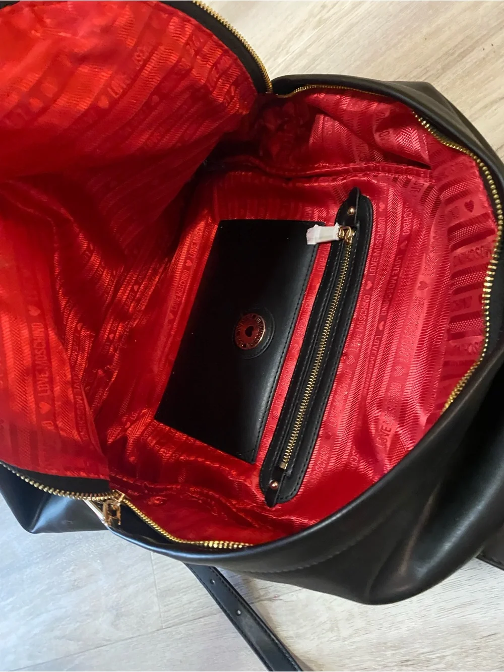 Love Moschino Black Backpack with Gold Logo and Red Tassel